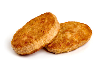 Fried pork schnitzels in breadcrumbs, isolated on white background.