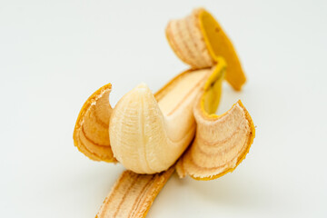 peeled banana on white close up isolated