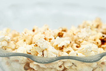 close up of popcorn on a white background