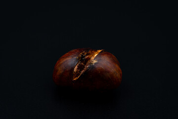 chestnuts on black background