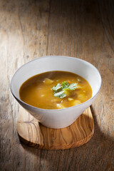 Vegetable soup on a wooden table