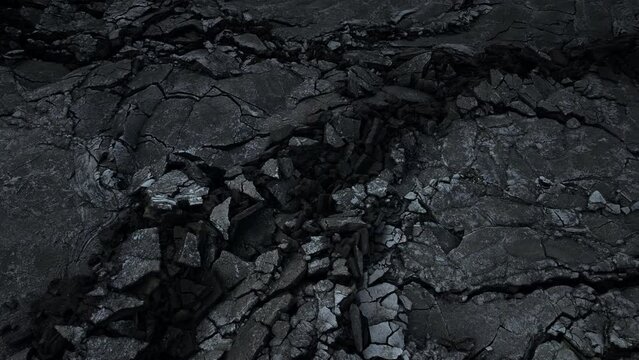 Dramatic cracks in the ground in Icelands volcano eruption site, aerial view at night