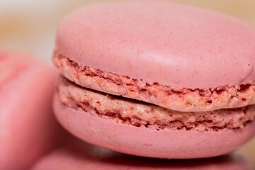 Pink macarons up close. Ideal for bakery banners and sweet treat promotions. 
