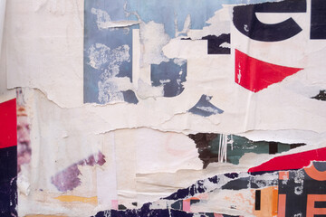 Fototapeta premium Torn and ripped street poster background, abstract paper collage 