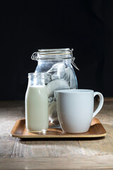 Obraz na płótnie Canvas Jar of teabags, milk and mug.