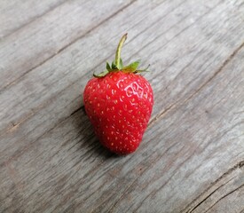 Fresh red strawberries on wood background
