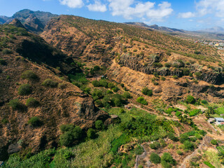 Fototapeta na wymiar Barragem Principal in Santiago Island, Cape Verde, water dam view from the top of the mountain, view of the sea, mountains and small village.