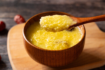 millet congee or millet porridge with jujube in a bowl  on tabe.