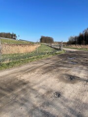 Gravel road next to the highway.