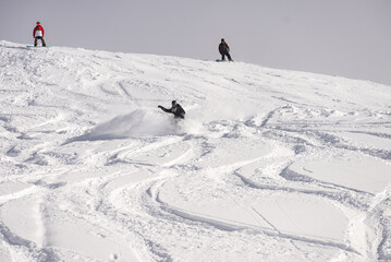 Freeride powder, snowboarding in Les deux alpes resort in winter, mountains in French alps, Rhone...