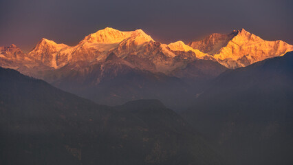 A view of Snow clad Kangchenjunga, also spelled Kanchenjunga, is the third highest mountain in the world. It lies between Nepal and Sikkim, India,