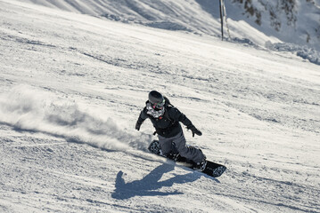 Freeride powder, snowboarding in Les deux alpes resort in winter, mountains in French alps, Rhone...