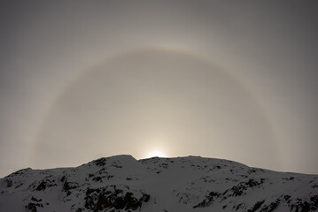 Halo efect an optical phenomenon. Snowy alps mountains in Europe.. French alps in winter, Les deux...