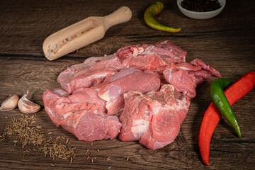 Fresh and raw meat. Sirloin medallions steaks in a row ready to cook. Background black blackboard