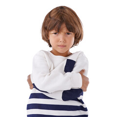 Boy, child and angry in portrait with arms crossed, frustrated and stress, emotion and frown on white background. Youth, upset or disappointed with tantrum, bad attitude with problem in studio