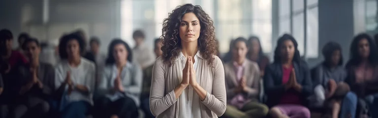 Gartenposter Adult brunette curly woman on right about to start meditation. Group of women came to yoga class beginning to relax and feel pleasure of stretching © lenblr