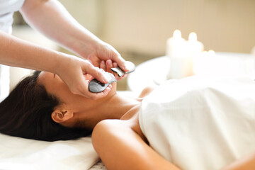Fototapeta na wymiar Face massage or beauty treatment in spa salon. Face massage or beauty treatment in spa salon