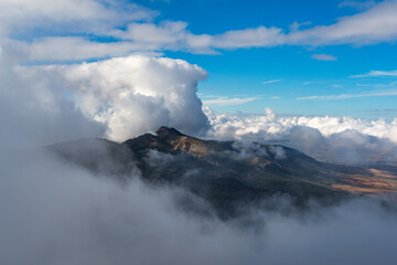 Fototapeta na wymiar Majestic Sierra Nevada Peaks Rising Above the Clouds