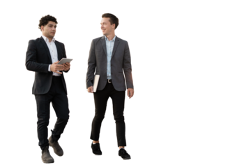 Two businessmen are talking to each other and their colleagues in the office. They are standing on a clear background.