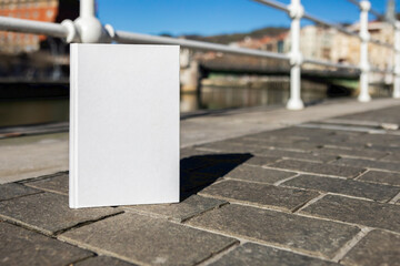 Book with a blank cover to be able to write text or change the cover perched next to the Bilbao...