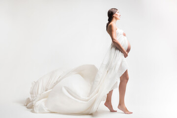 Young pregnant woman in studio