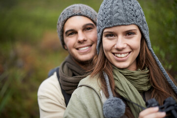 Fototapeta premium Couple, portrait and happy outdoor with travel for bonding, love and relationship with hug or holiday. Man, woman and face with embrace or smile on vacation, trip and carefree with romance and care