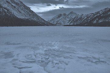 Snow-covered winter mountain lake, Russia, Siberia, Altai mountains.