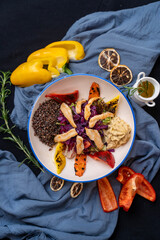 Chicken bowl salad served with fresh and fried vegetables