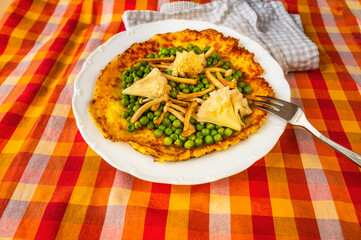 Egg omelette, boiled pea, shimeji mushroom and rose-shaped cheese on table.
