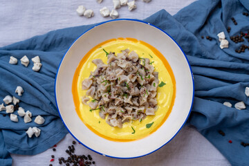 Homemade ravioli served with butter and garlic yoghurt