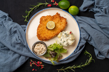 Chicken Schnitzel served with Russian salad