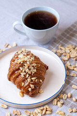 peanut croissant served with coffee