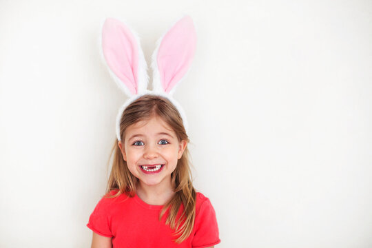 Happy little girl wearing funny bunny ears