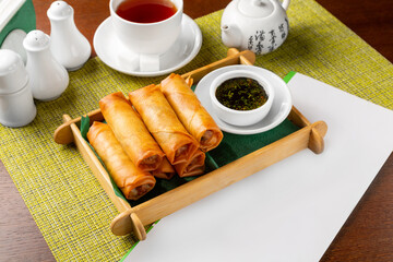 Spring rolls with meat and soy sauce.