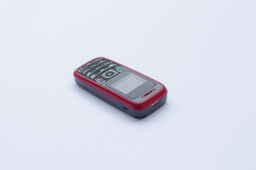 Old cell phone on white background, vintage cell phone