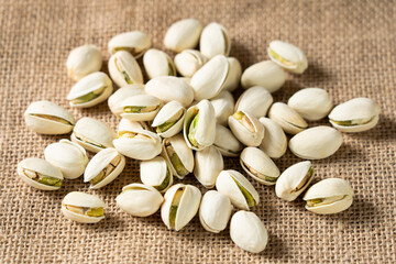 roasted salted pistachio nuts on table.