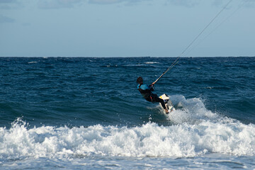 Fototapeta premium Kite surfing.Windsurf.Kite boarding. To fly a kite. Surfers of all ages train in the Mediterranean. Flying a kite on the beaches of Cyprus.