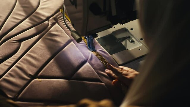 Muslim Woman Stitching a Prayer Mat Decoration on a Sewing Machine. Handmade
