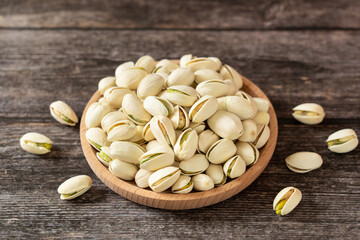 roasted salted pistachio nuts on table.