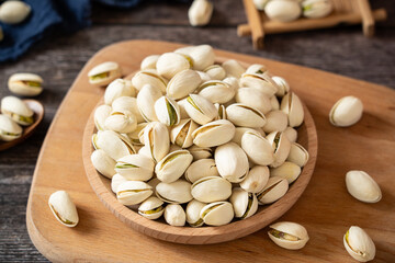 roasted salted pistachio nuts on table.