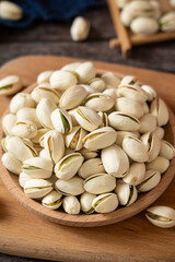 roasted salted pistachio nuts on table.