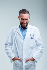 Enthusiastic stance and smile from happy doctor