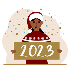 A woman in a red sweater and with a cap holds a sign or poster with the numbers 2023. Postcard or greeting Merry Christmas and Happy New Year.