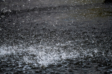 water splash with small drops in the fountain, abstract natural, selective focus background