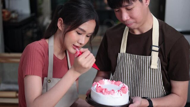 Homemade, happy relaxing and wellness at home. Young asian man and woman preparing birthday cake for friends