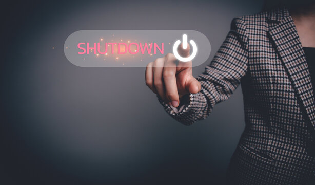 Businesswoman hand pressing the shutdown button on the virtual screen. Digital technology, system shutdown or stops working concept.