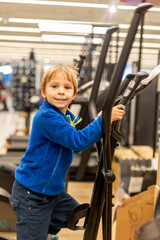 Child, preschool boy, training in gym, fitness center