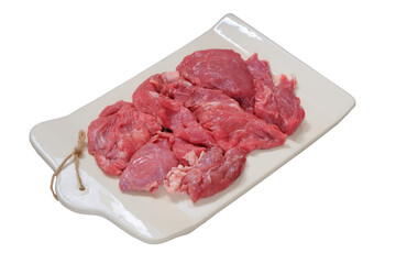 Cut of meat in ceramic tray. Isolated in white background. Raw meat for cooking.
