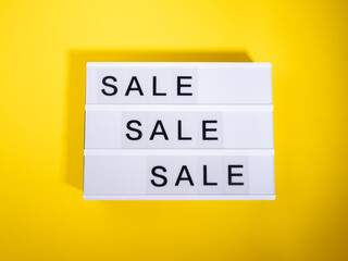 Sale store concept with lightbox text on yellow background - 717872783