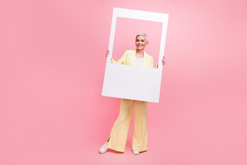 Full size photo of good mood woman dressed yellow suit posing in photo frame make instant picture...